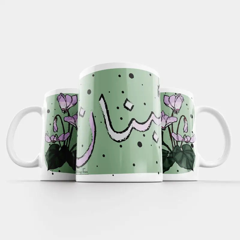 Green Lebanese mugs with the cyclamen flower sketched and Lebanon written in Arabic. Lebanese Floral mug